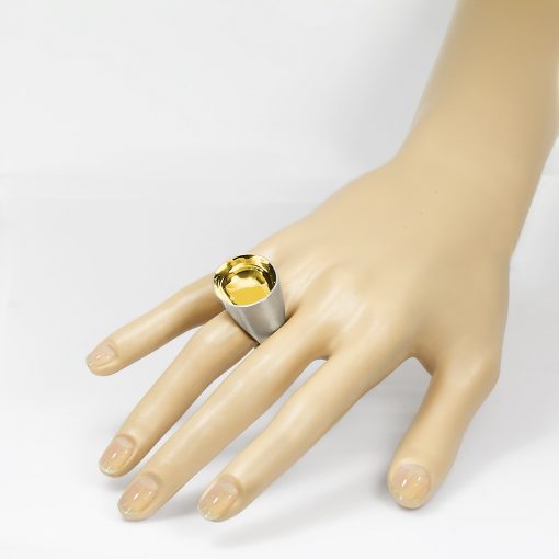 The Saarinen ring from The Modernists collection is handmade by Julie Bégin using sterling silver with 14k gold.